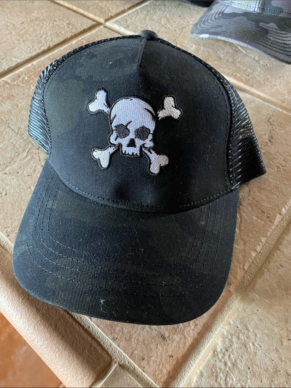 Men’s Black Trucker Hat with White Skull Patch